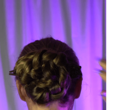 a woman with a hairdoodle updo with a braid braid