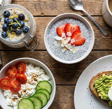 a table with bowls of food and a cup of coffee