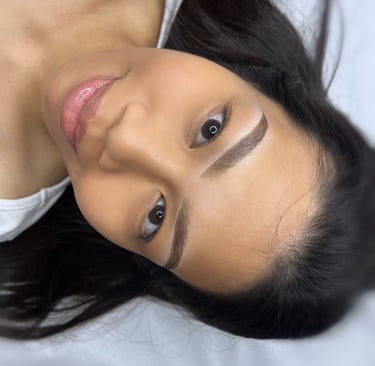 a woman with a white shirt and black hair