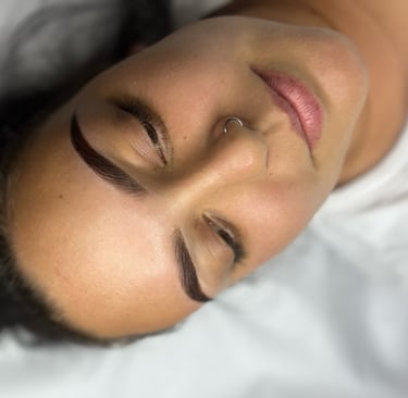 a woman is laying down on a bed