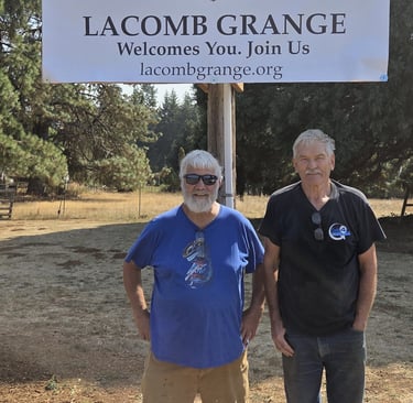Brent and Art in front of the banner