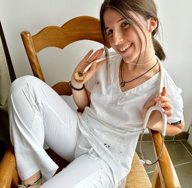 a woman sitting in a rocking chair with a donut