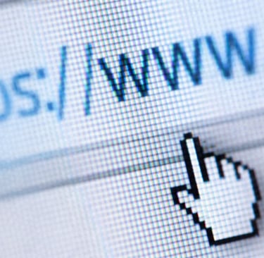 Close-up of a mouse cursor clicking on a secure HTTPS website address bar on a screen.