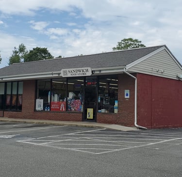 exterior of the convenience store building and part of the parking area