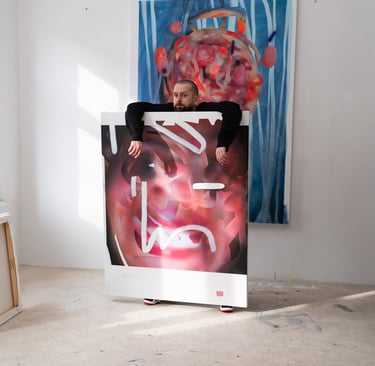 Contemporary artist in his studio leaning over a large abstract expressionist oil painting.