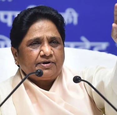 BSP leader Mayawati raising her hand while speaking at a press conference in India.