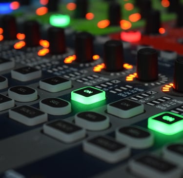 Control panel of an analog synthesizer with buttons, knobs, and LED lights.