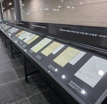 Museum display cases with personal written items