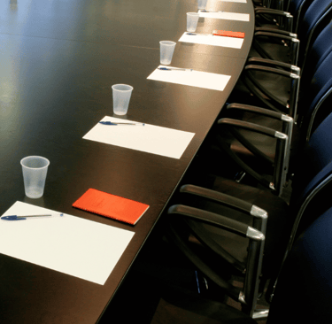 Corporate boardroom table setup for strategic governance meetings