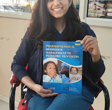 a woman in a wheelchair holding a book