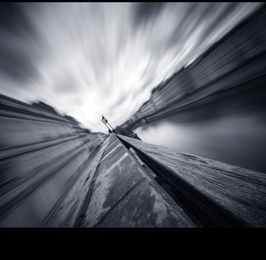 a person standing on a rock in the middle of a mountain