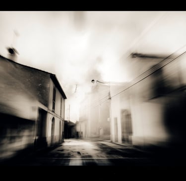 a street scene with a blurry image of a street light