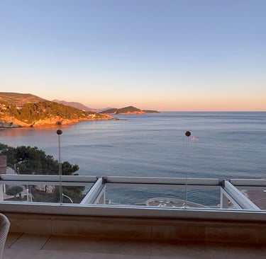 a balcony with a view of the ocean