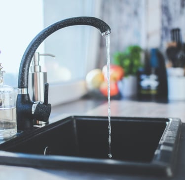 a kitchen sink with a faucet faucet faucet fauce