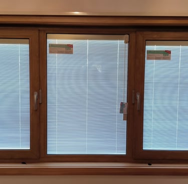 Integral blinds in uPVC window by Skill Construction