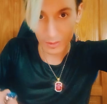 a man with a green hair and a necklace