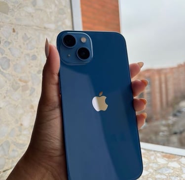 a person holding a blue iphone 11 pro with a blue iphone 11