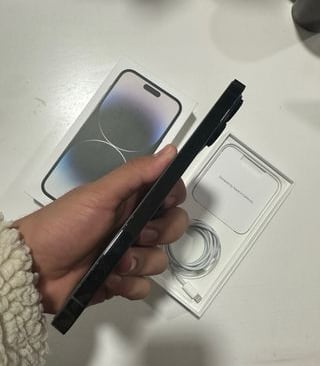 a person holding a iphone and in their hand