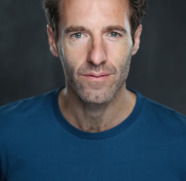 Film production company producer/director James Rose wearing a blue shirt