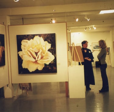 Sandra Forzani talking with a customer in a gallery