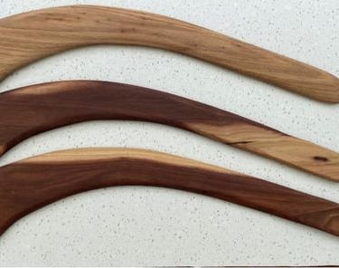 3 hunting boomerangs on a table