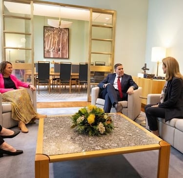 a group of people sitting around a table
