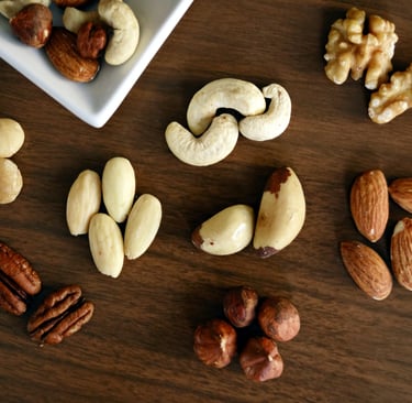 nuts like almond, walnuts  are on a table it is rich in vitamin b12