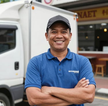 A delivery van parked outside a bustling café, with frozen food boxes ready for unloading.