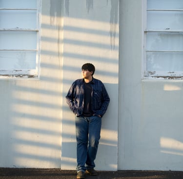 a man standing in front of a building