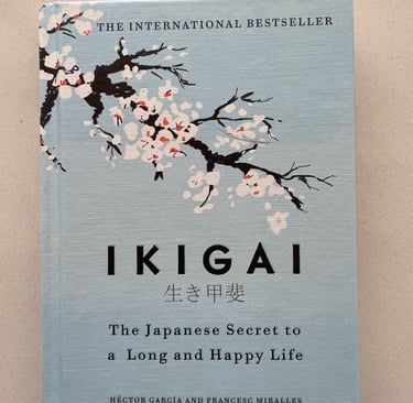 a book cover of a book IKIGAI with a cherry blossom