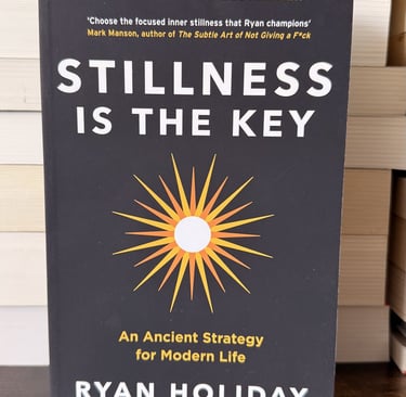 a book cover of a book with a sun shining in ithe background