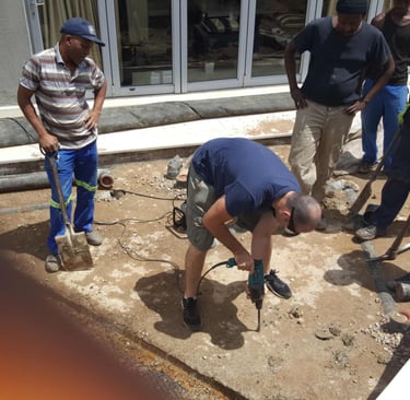 Slowly drilling of the slab to release trapped water for advanced waterproofing project, Sandton, Fredman Drive