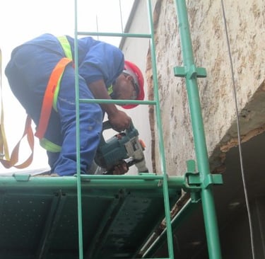 Mechanical stripping of compromised exterior plaster for waterproofing works, Sandhurst Towers, Sandton