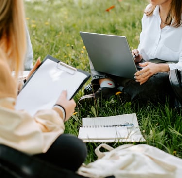 Pure Mathematics Online Tutoring students studying whilst sitting in the grass