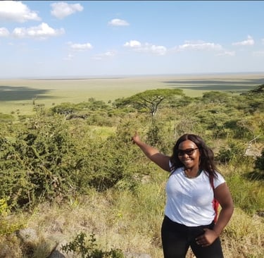 A lady surrounded by Serengeti plains
