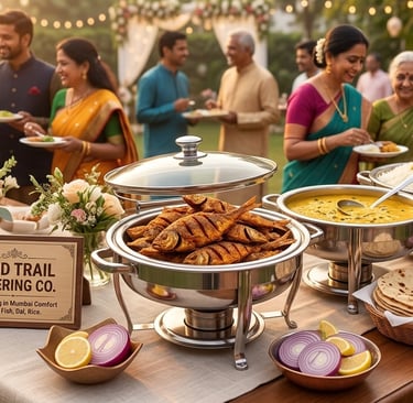 Guests enjoying an outdoor Indian wedding buffet featuring fried fish, dal, and rice catered by Food Trail Catering Co.