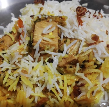 a plate of food with rice and meat