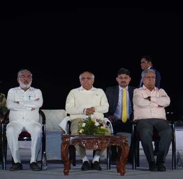 a group of men sitting in chairs with their arms crossed