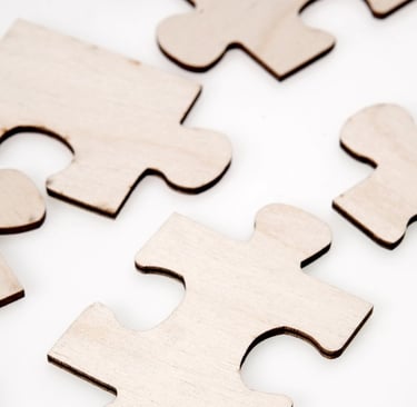 Image of wooden jigsaw puzzle pieces to represent fractional services