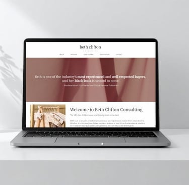 Photo of laptop screen showing Beth Clifton Consulting's homepage