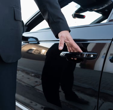 a man in a suit and tie is holding a cell phone