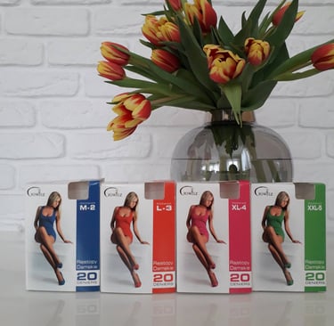 a vase with a vase of flowers in front of a white brick wall