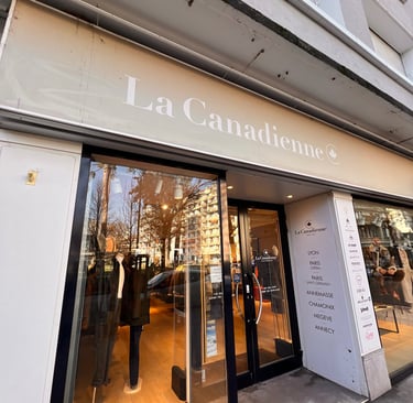 a storefront door with a large window and a sign that says la canada