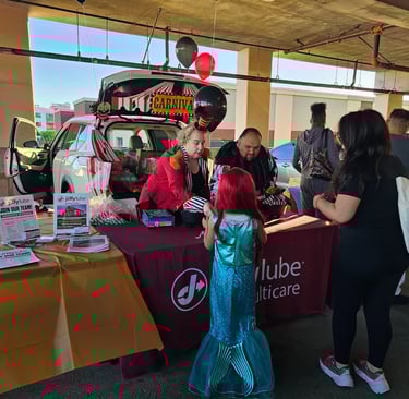 Jiffy Lube Employees passing out candy on Halloween