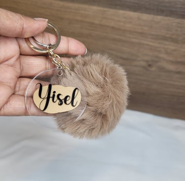 a keychain with Pom Pom Balls