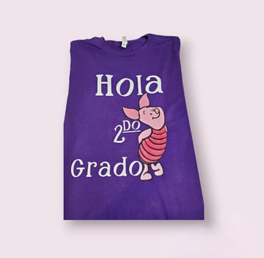 a purple T-shirt with a piggy.