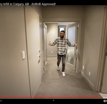 a man in a plaid shirt is standing in a hallway
