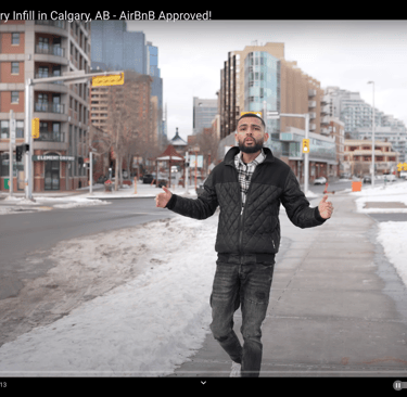 a man in a black jacket and a white shirt
