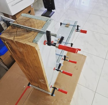 a clamped up to a table top with a clampe of tools