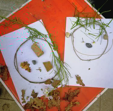 A red table with paper and leaves on it.